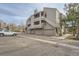 Exterior of a multi-unit residence with parking, providing convenience and modern appeal at 23678 Pondview Pl # D, Golden, CO 80401