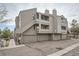 A multi-story building with multiple balconies and garages, ideal for modern living at 23678 Pondview Pl # D, Golden, CO 80401