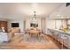 Dining area showcasing modern table set, kitchen bar, and open layout design at 23678 Pondview Pl # D, Golden, CO 80401