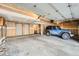 Spacious garage with a blue Jeep parked inside at 23678 Pondview Pl # D, Golden, CO 80401