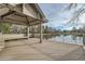 Charming lakeside gazebo with seating, offering serene views and a tranquil atmosphere at 23678 Pondview Pl # D, Golden, CO 80401