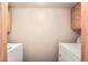 Functional laundry room with modern machines and cabinetry at 23678 Pondview Pl # D, Golden, CO 80401