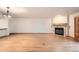 Spacious living room features hardwood floors, fireplace, and modern lighting at 23678 Pondview Pl # D, Golden, CO 80401