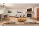 Staged living room boasts a stone fireplace, stylish decor, and comfortable seating arrangement at 23678 Pondview Pl # D, Golden, CO 80401