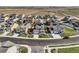A street-level aerial of homes in a planned community with manicured lawns at 16308 Saint Paul St, Thornton, CO 80602