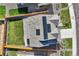 A roof-level shot of a modern home and yard, showcasing clean landscaping and fencing at 16308 Saint Paul St, Thornton, CO 80602