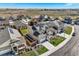 An aerial view of a new home development showcasing houses and landscaping at 16308 Saint Paul St, Thornton, CO 80602