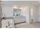 Bathroom featuring a bathtub and a double sink with great lighting at 16308 Saint Paul St, Thornton, CO 80602