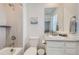 Bathroom featuring a shower, toilet, and vanity with a white countertop and modern fixtures at 16308 Saint Paul St, Thornton, CO 80602