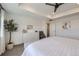 Light-filled main bedroom boasts a decorative ceiling, soft carpet, and neutral color palette at 16308 Saint Paul St, Thornton, CO 80602