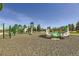 Community playground features green climbing structures, slide, and padded ground at 16308 Saint Paul St, Thornton, CO 80602