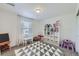 Bright playroom with a geometric rug, toys, and a large window offering natural light at 16308 Saint Paul St, Thornton, CO 80602