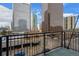 Balcony with city views and a metal railing at 1800 Lawrence St # 408, Denver, CO 80202