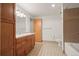 Clean bathroom with updated vanity and tiled shower/tub at 1800 Lawrence St # 408, Denver, CO 80202