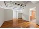 Bedroom with hardwood floors and access to a closet and bathroom at 1800 Lawrence St # 408, Denver, CO 80202