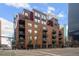 Modern brick building in urban setting with balconies at 1800 Lawrence St # 408, Denver, CO 80202