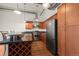 Updated kitchen featuring stainless steel appliances and wood cabinetry at 1800 Lawrence St # 408, Denver, CO 80202