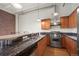 Modern kitchen with stainless steel appliances and granite countertops at 1800 Lawrence St # 408, Denver, CO 80202