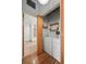 Laundry area with washer, dryer, shelves, and access to a bathroom at 1800 Lawrence St # 408, Denver, CO 80202