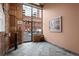 Building lobby with brick walls, tile floor, and city view at 1800 Lawrence St # 408, Denver, CO 80202