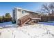 Home features a deck and stairs leading to the backyard at 2030 Santana Dr, Castle Rock, CO 80104