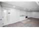 Bright, open basement with a door leading to a bathroom and additional space at 2030 Santana Dr, Castle Rock, CO 80104