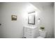 Basement bathroom with white vanity, marble countertop and framed mirror at 2030 Santana Dr, Castle Rock, CO 80104