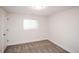 Finished basement bedroom with window and neutral carpeting at 2030 Santana Dr, Castle Rock, CO 80104