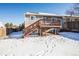 Back of house showing deck and fenced backyard at 2030 Santana Dr, Castle Rock, CO 80104