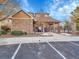 Community center with a stone exterior, fenced entry, and landscaping at 1358 Carlyle Park Cir, Highlands Ranch, CO 80129