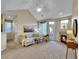 Spacious living room with neutral colors, lots of natural light, and a cozy fireplace at 1358 Carlyle Park Cir, Highlands Ranch, CO 80129