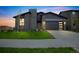 Modern two-story home with attached garage and landscaped lawn at 3839 Buchanan Way, Aurora, CO 80019