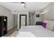 Bright bedroom with neutral tones, large mirror, and closet at 534 E 7Th Ave # 206, Denver, CO 80203