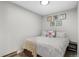 Cozy bedroom featuring a plush bed, wall art, and a warm, inviting ambiance at 534 E 7Th Ave # 206, Denver, CO 80203