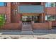 Governor's Abbey brick entrance features a small seating area and glass front doors at 534 E 7Th Ave # 206, Denver, CO 80203