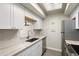 Bright kitchen with stainless steel appliances, modern countertops, and lots of storage at 534 E 7Th Ave # 206, Denver, CO 80203