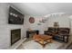 Living room showcases a fireplace, comfortable seating, and a view to the kitchen at 534 E 7Th Ave # 206, Denver, CO 80203