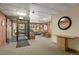 Inviting building lobby features brick walls, a carpeted floor, and access to the outside at 534 E 7Th Ave # 206, Denver, CO 80203