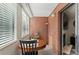 Well-lit patio featuring a round table with seating and a view into the living room at 534 E 7Th Ave # 206, Denver, CO 80203