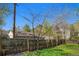 Wood fence enclosing backyard featuring mature trees and mountain views beyond at 2109 Jackson St, Golden, CO 80401