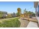 Backyard featuring a wooden deck that leads to a lush lawn, perfect for relaxation and play at 9544 Longford Way, Parker, CO 80134