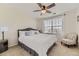 Cozy bedroom featuring a ceiling fan, window with blinds, and carpeted floors at 9544 Longford Way, Parker, CO 80134