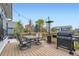 Spacious wooden deck with dining set and grill, perfect for outdoor entertaining at 9544 Longford Way, Parker, CO 80134