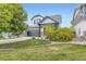 Charming two-story home featuring a two-car garage, stone accents, and a well-manicured front yard at 9544 Longford Way, Parker, CO 80134