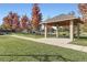 Community park featuring a shaded pavilion and mature trees with vibrant fall colors at 9544 Longford Way, Parker, CO 80134