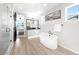 Elegant bathroom featuring a freestanding tub and double sinks at 6307 E 141St Ln, Thornton, CO 80602