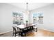 Bright dining room featuring a live-edge wood table and bench at 6307 E 141St Ln, Thornton, CO 80602