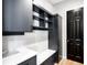 Modern pantry with white countertops and dark grey cabinets at 6307 E 141St Ln, Thornton, CO 80602