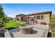 Expansive backyard with a covered patio, pergola, and lush landscaping, perfect for outdoor living at 2134 S Poppy St, Lakewood, CO 80228