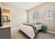 Cozy bedroom with neutral decor, comfortable bed, and ample natural light at 2134 S Poppy St, Lakewood, CO 80228